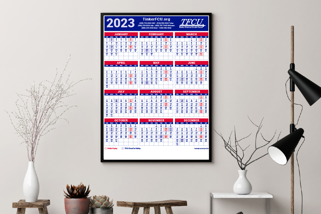 2023 calendar on the wall with shelves with books and plants