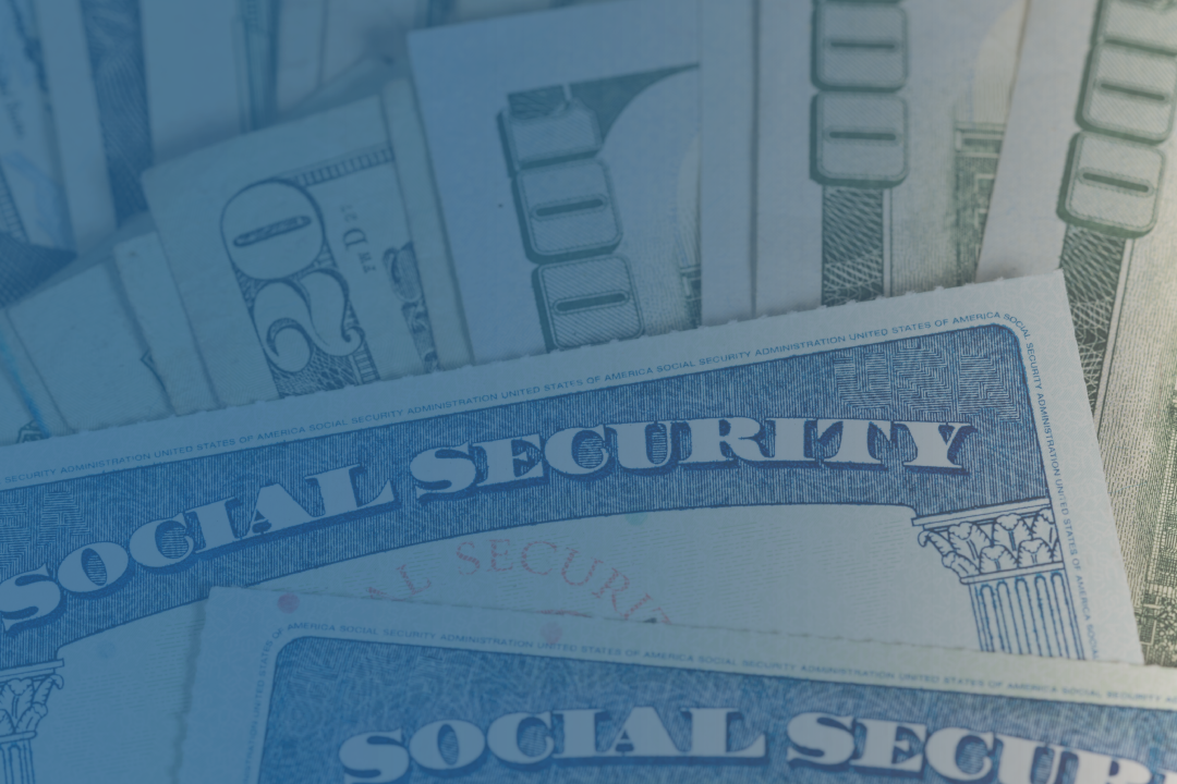 Hundred dollar bills and social security cards